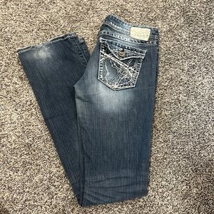 Woman’s silver jeans